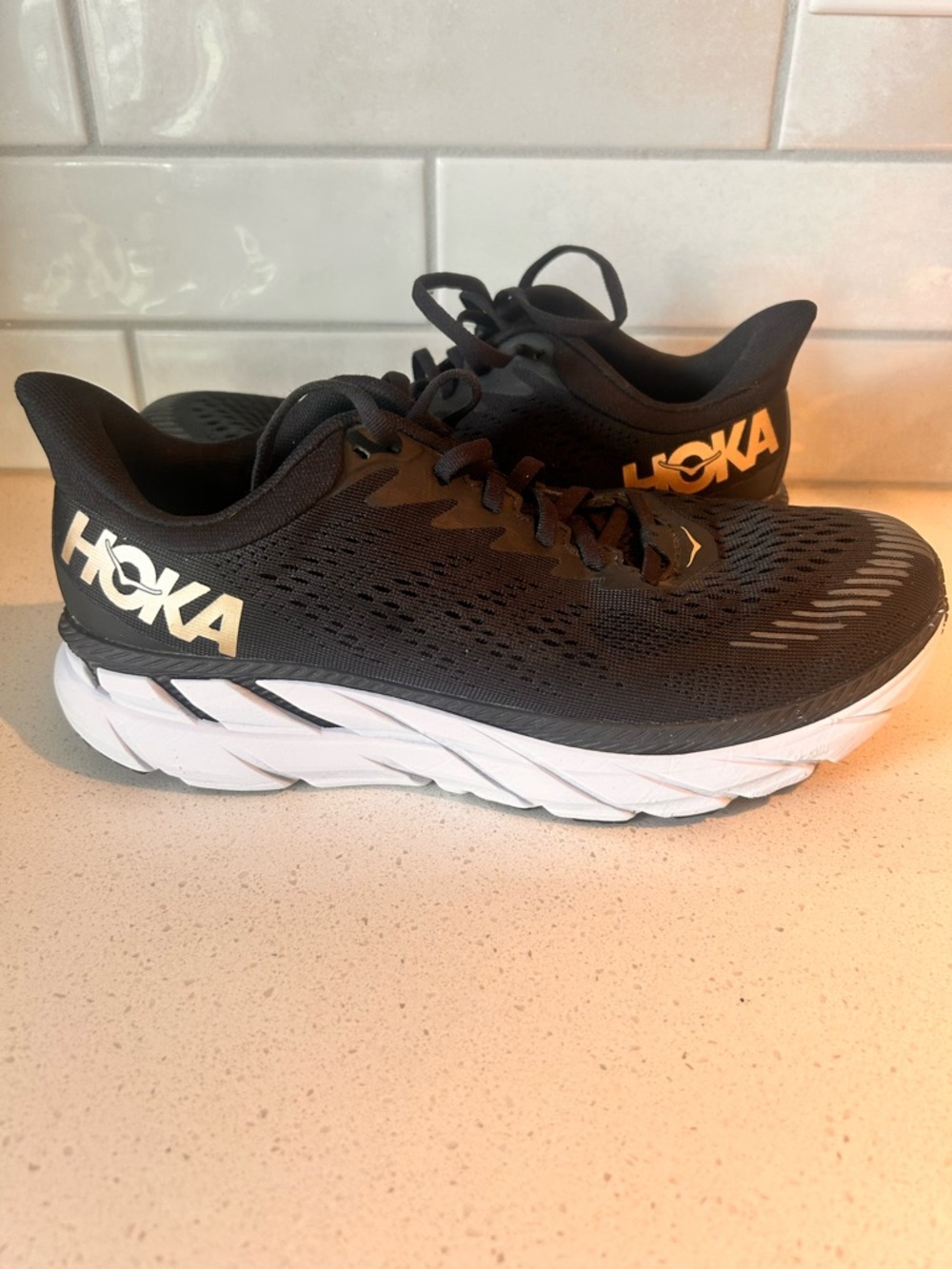 Hoka Clifton 7 Black and White With Gold Accent Running Shoes